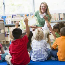 A female teacher teaching her students