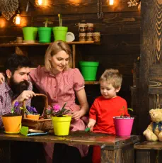 A couple looking at their child playing