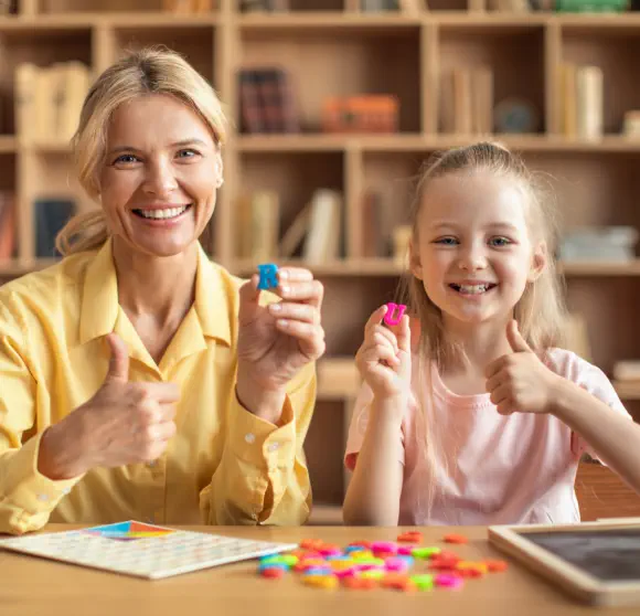 a mother and her daughter playing together