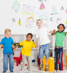 Four children jumping together