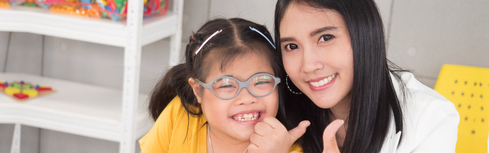 A woman and a child smiling together