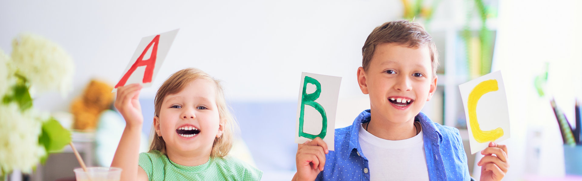 two kids playing with the alphabets