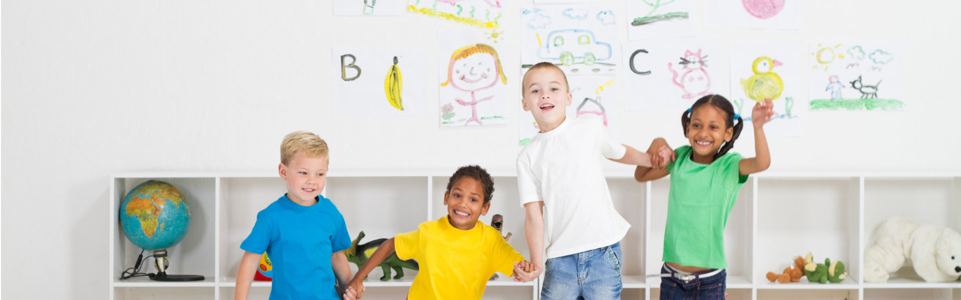 Four children jumping together
