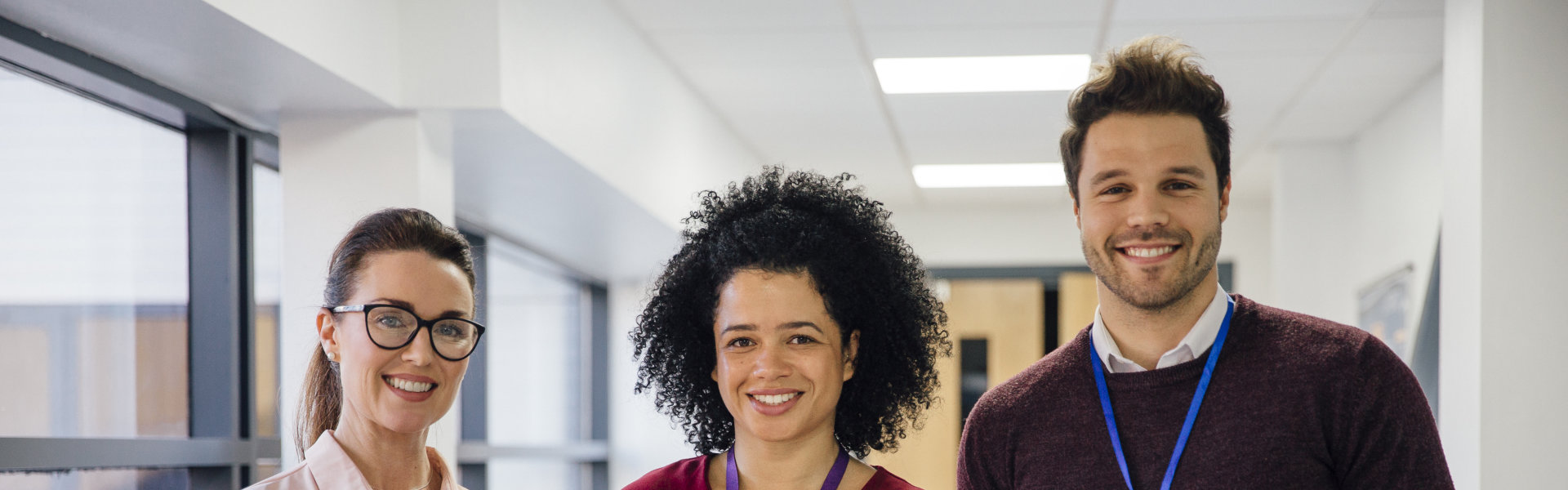 Three person smiling together